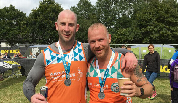 “We did it!”  Dan and James celebrate after completing the Lakes Challenge in seven hours!