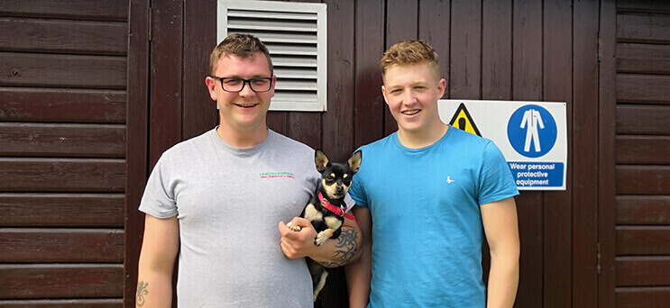 Ashley, owner of AR Waines and apprentice Levi, with Cleo the team mascot