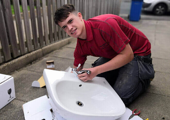 William hard at work installing a new bathroom