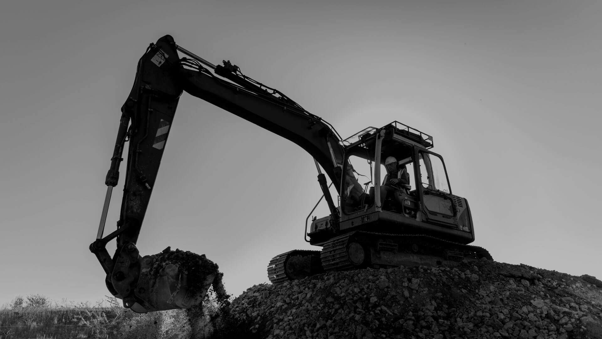 Digger On Building Site Header